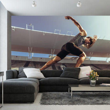 Fototapeta Sprinter Wybiegający Z Bloku Startowego
