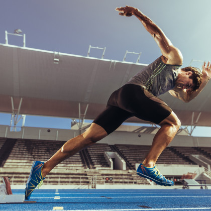 Fototapeta Sprinter Wybiegający Z Bloku Startowego